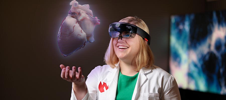 Student in VR headset with VR heart