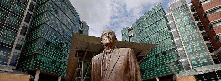Statue of Charles Durham in front of Durham Research Towers