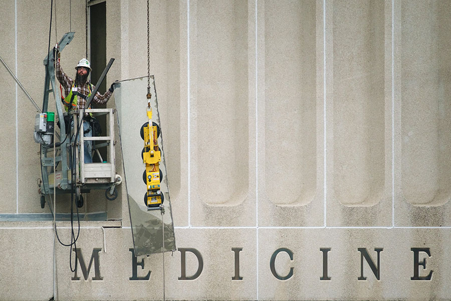 Construction worker on a lift at UNMC.