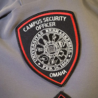 The shield of a UNMC campus officer.