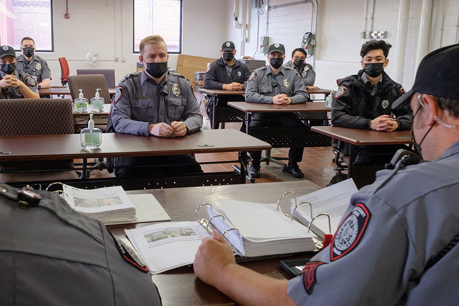 UNMC officers meet before starting a patrol shift.