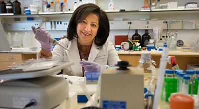 Researcher with pipette in lab