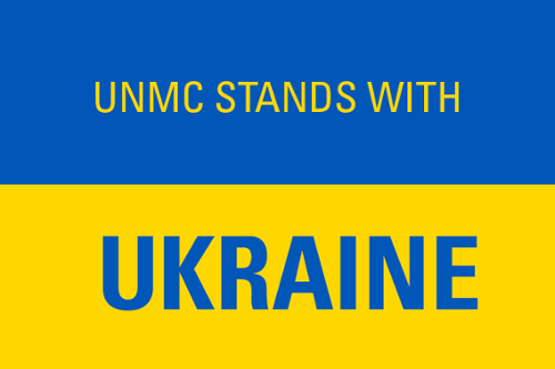 Blue and yellow graphic with the words UNMC Stands With Ukraine