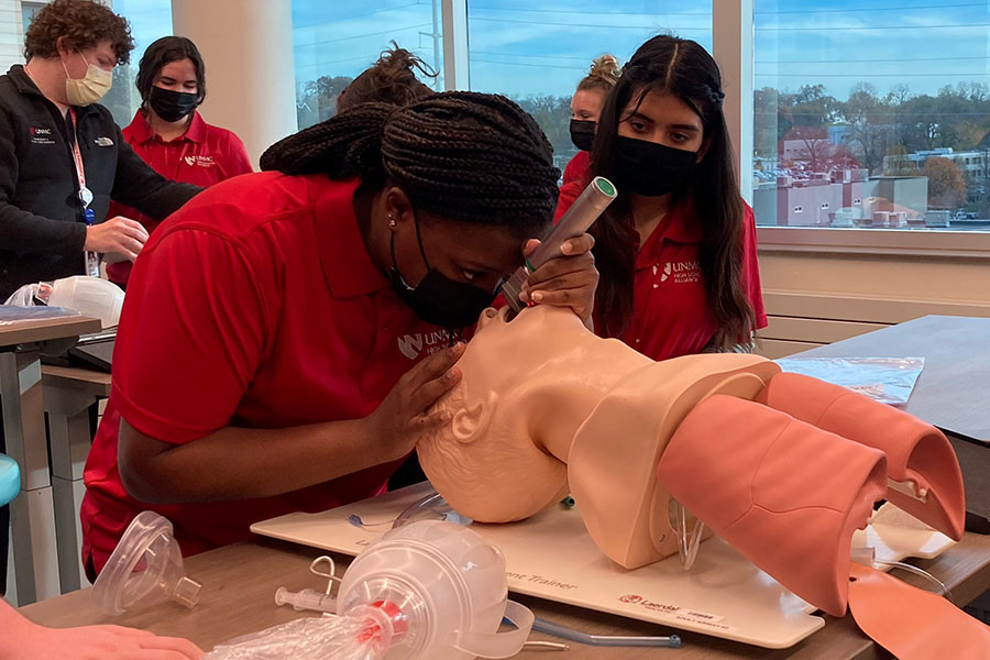 High school student practicing on a dummy