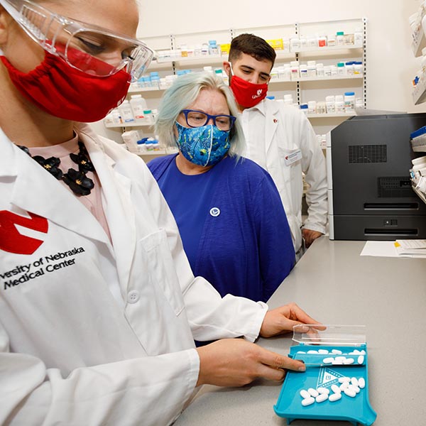 Pharmacy student counting medication