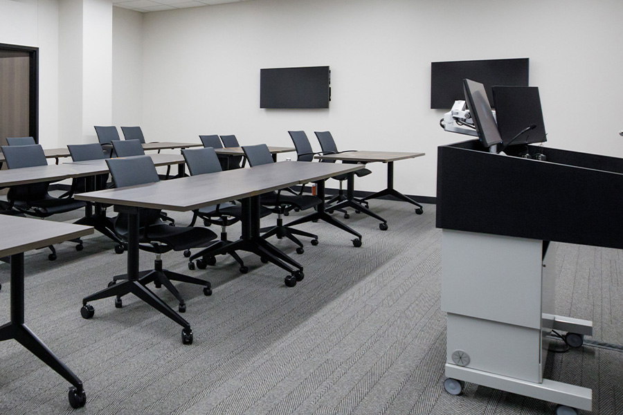 Practice classroom including podium and learner desks