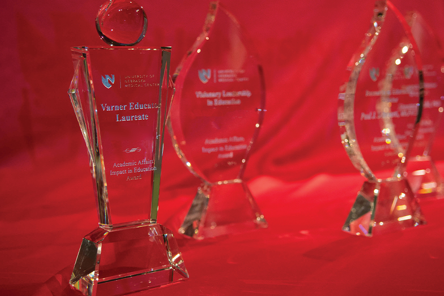 Impact in Education awards displayed on a table
