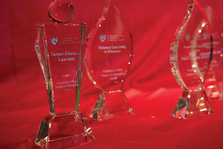 Faculty awards displayed on table