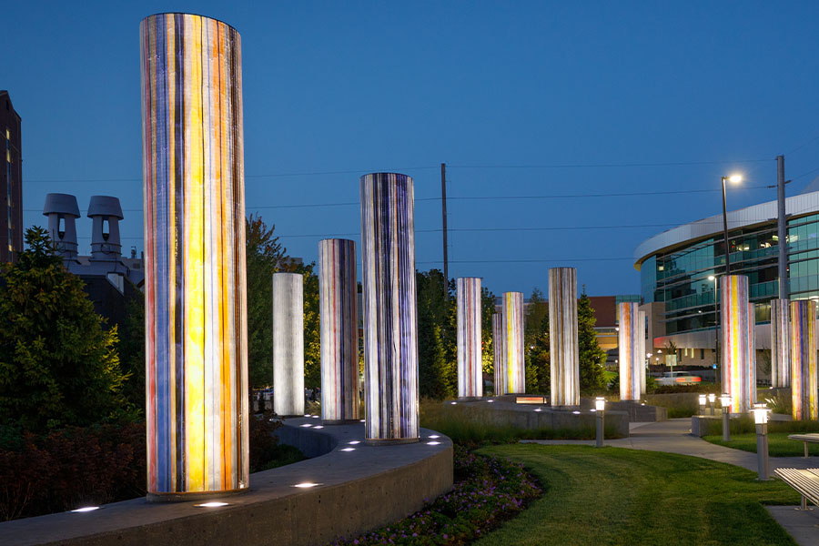 Medical plaza at night with pillars lit