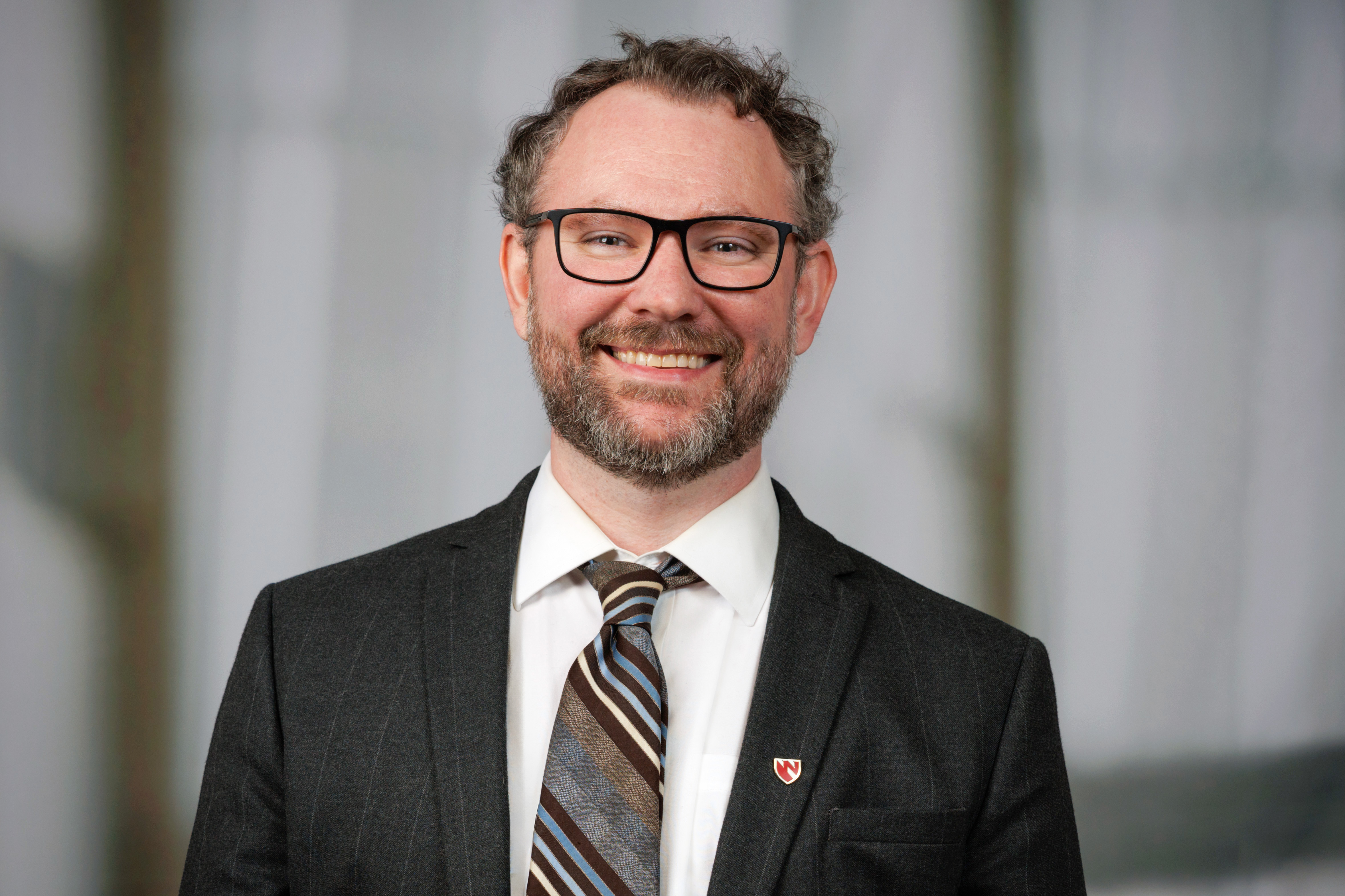 Andrew Robertson poses for a headshot