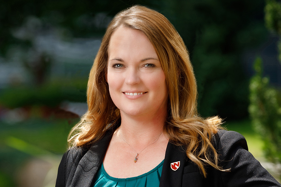 Dr. Kendra Schmid poses for a headshot