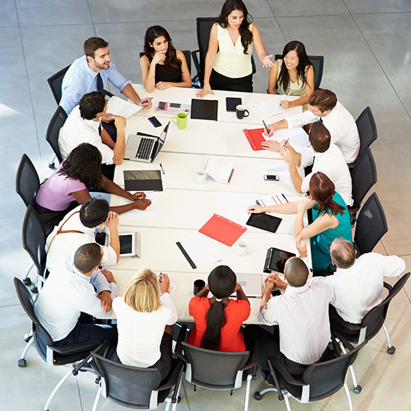 Senior leaders gathered around a table