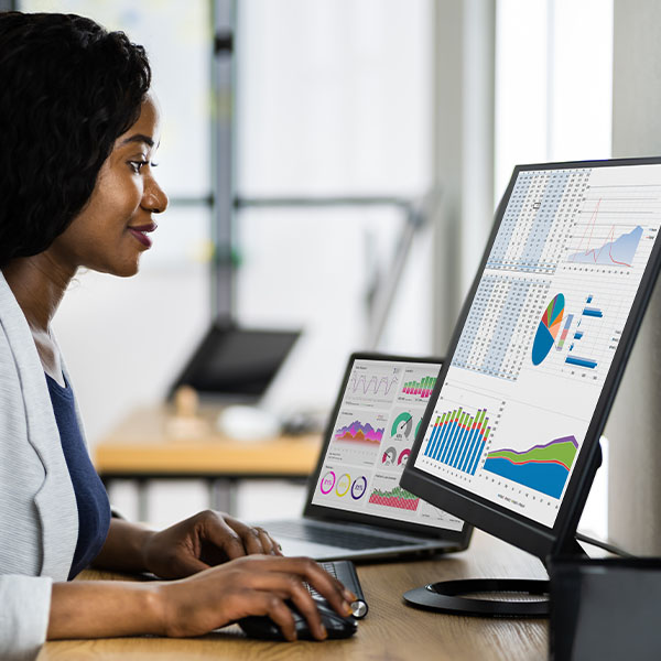 Person sitting at computer looking at data