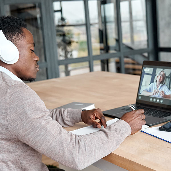 Learning sitting at table taking online course