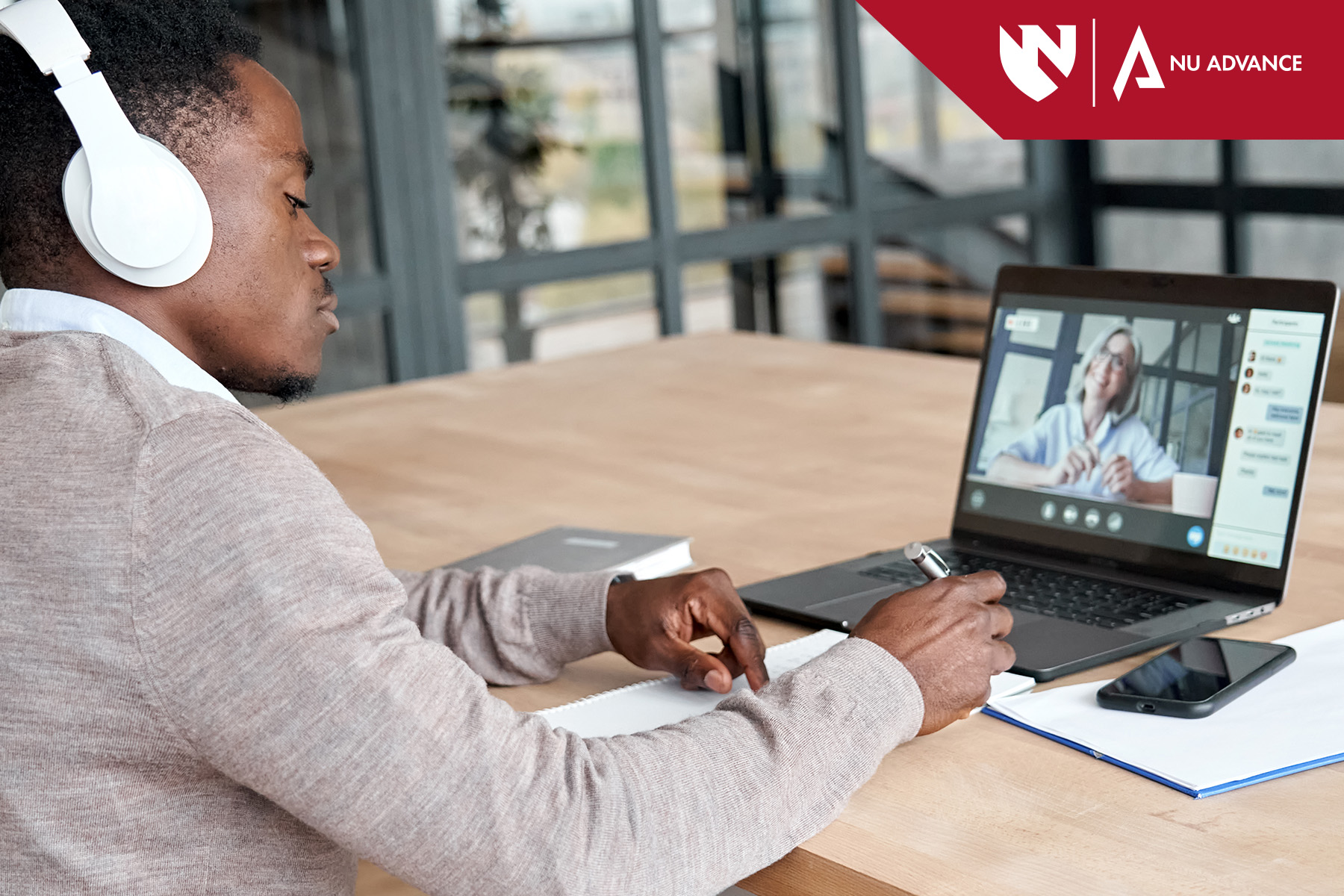 Adult learner sitting at computer attending online course