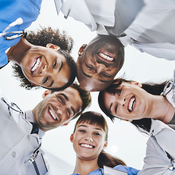 Health care students gathered in a huddle