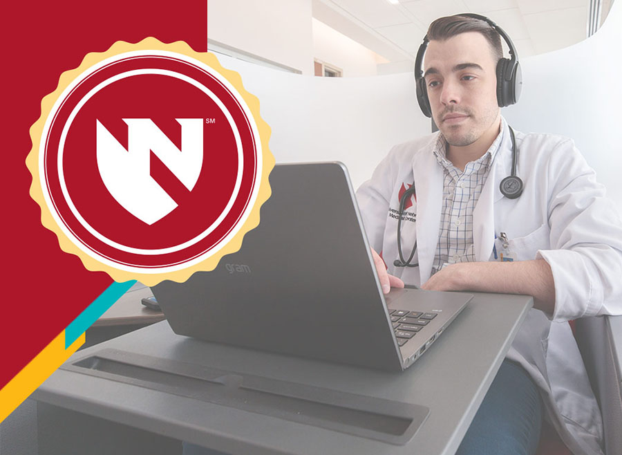 Adult learner sitting at computer attending online course