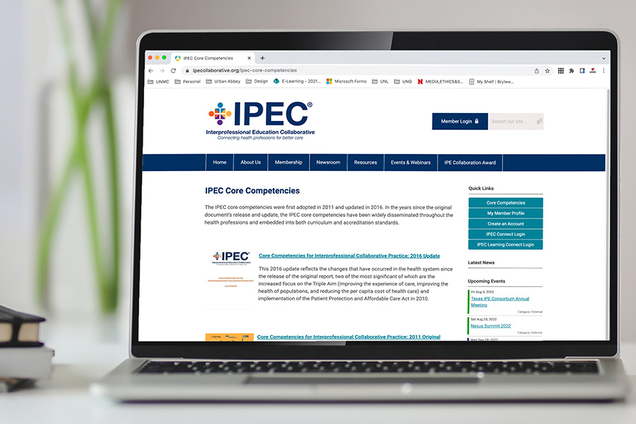 IPEC core competencies webpage shown on a laptop