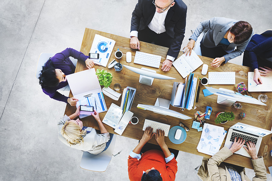 people collaborating around table