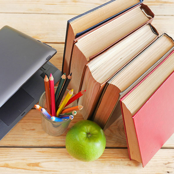 books and pencils on teacher's desk