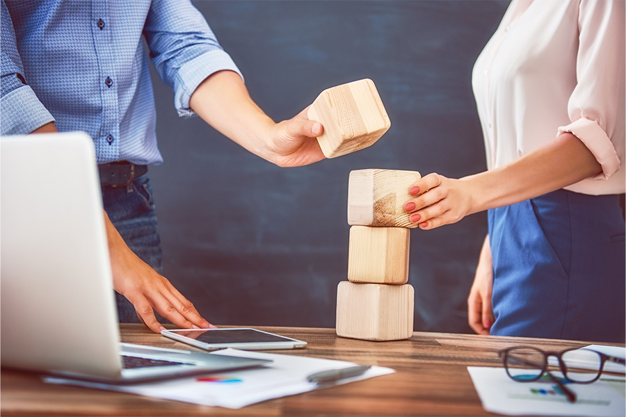 People using building blocks on a desk