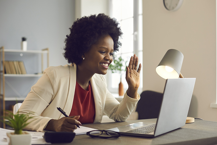Woman in virtual session on laptop