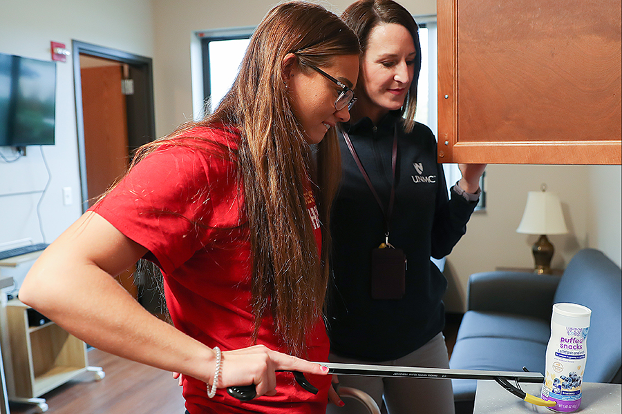 OT helps a client use a grabber to move objects