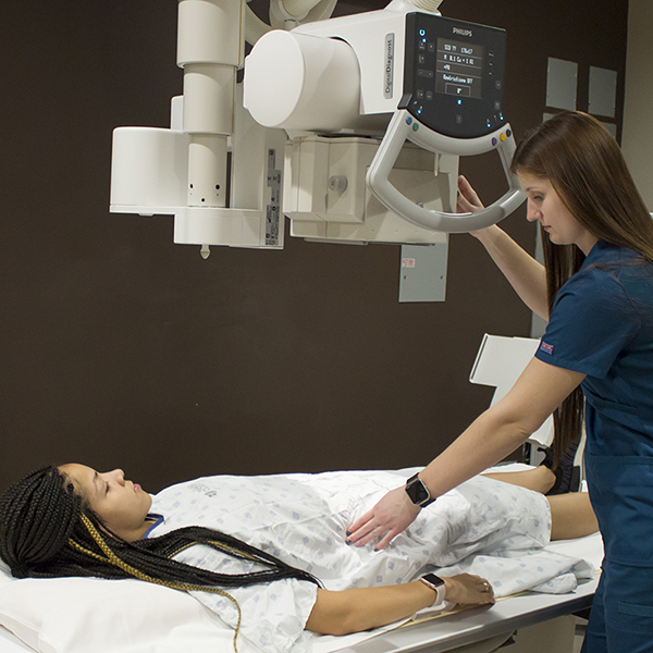 Radiographer positioning a patient