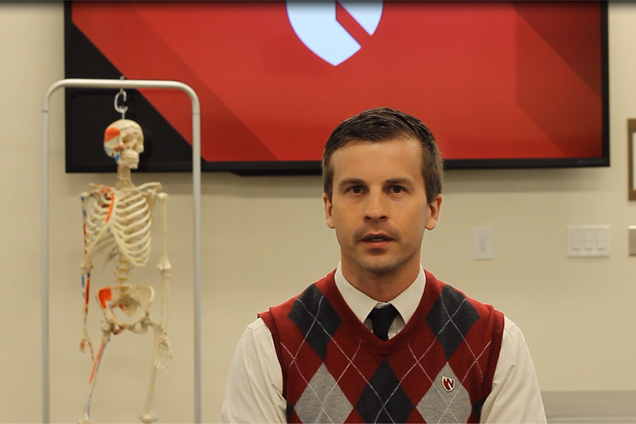 PT Resident speaks in a classroom