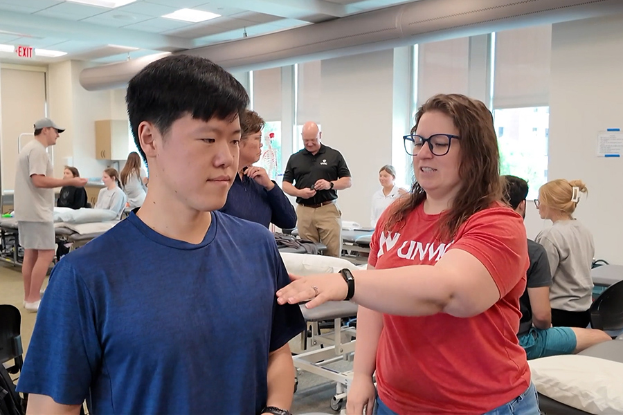 UNMC PT students practice in a large classroom