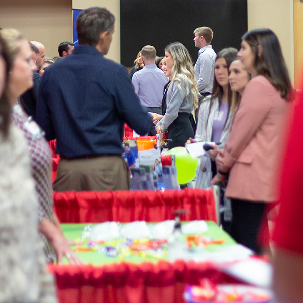 students visit booths at career fair