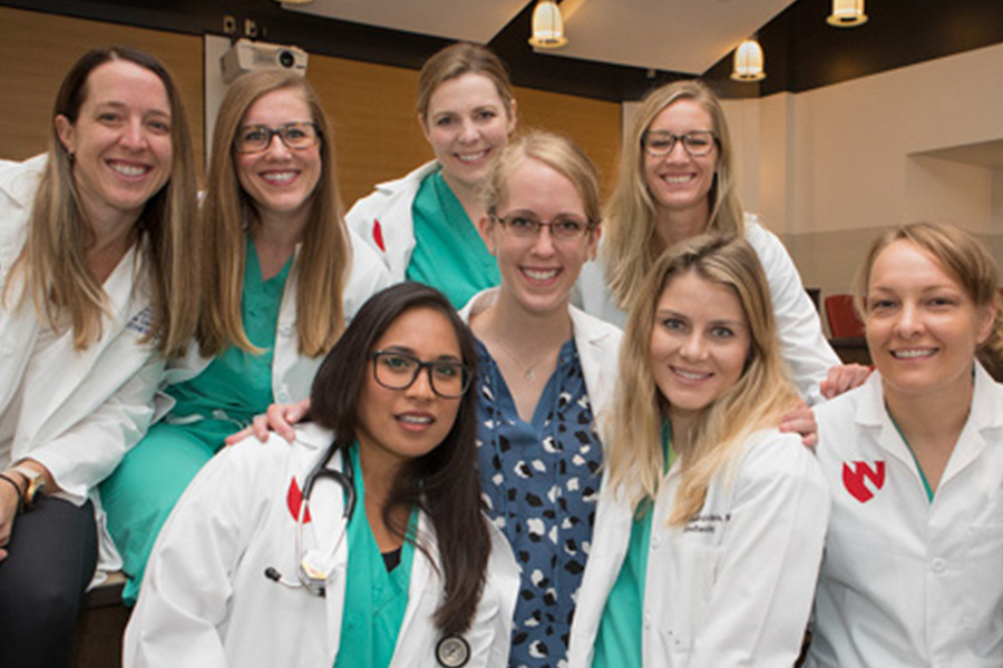 faculty and residents group photo in white lab coats