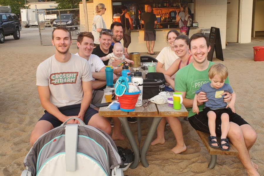 Residents relaxing together after a game of sand volleyball