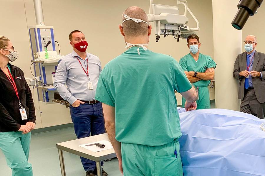 Surgeons and anesthesiologists participating in simulation training.