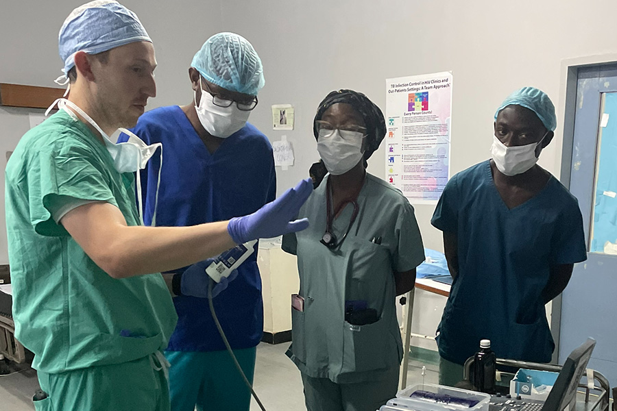 Department of anesthesiology global health team member training residents in Zambia