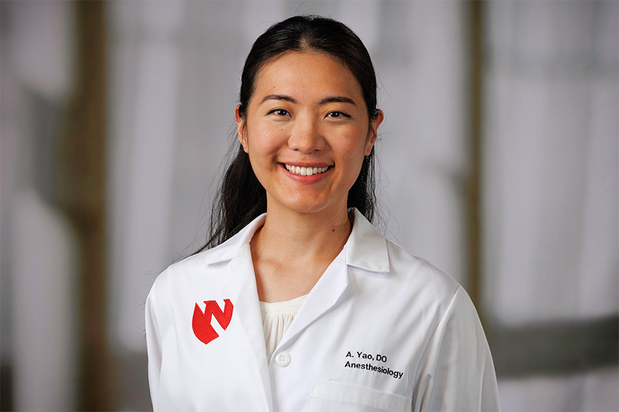 Annie Yao, DO, headshot with white lab coat