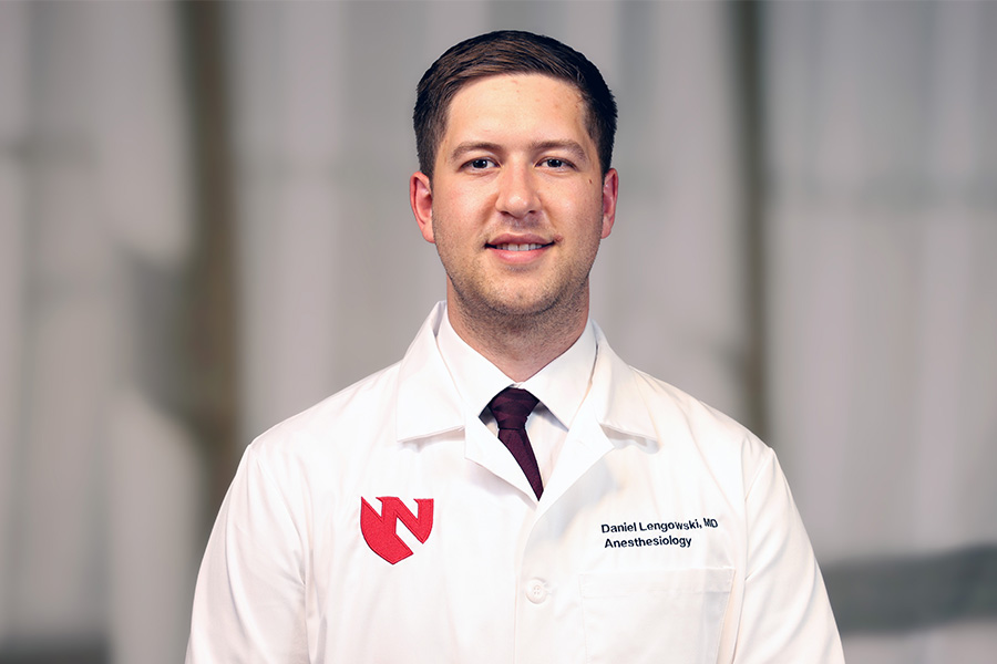Daniel Lengowski, MD, headshot with white lab coat