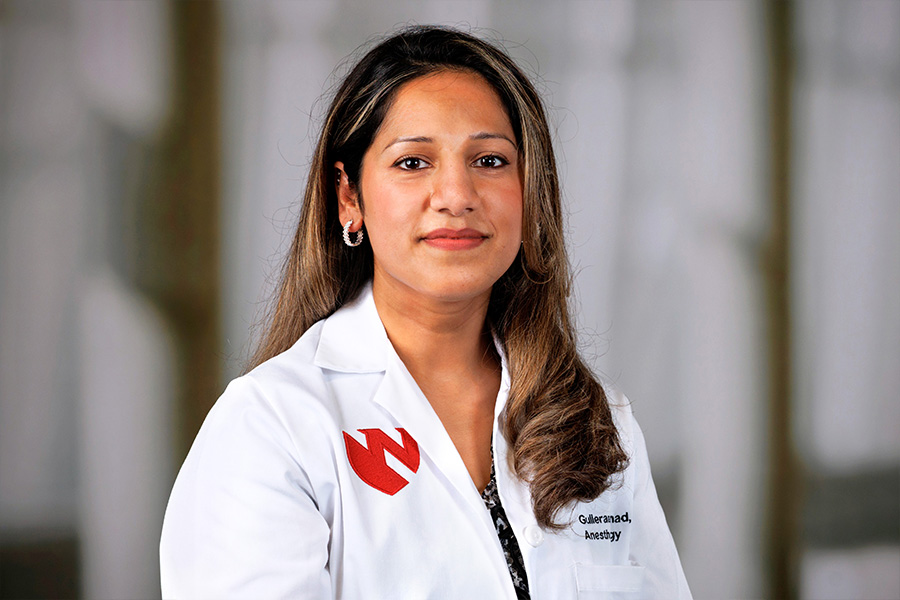 Gullerana Ahmad, MD, headshot with white lab coat