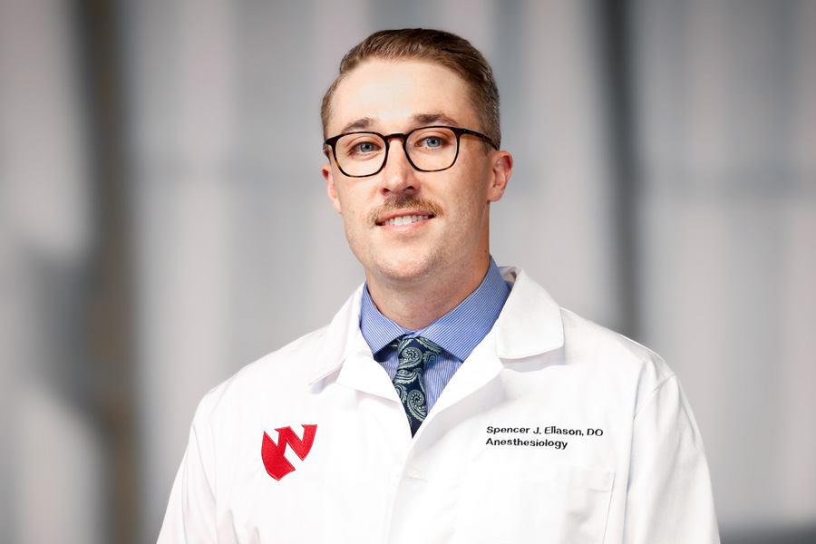 Spencer Eliason, DO, headshot with white lab coat