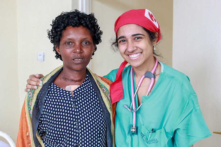 Anesthesiologist posing with patient in Rwanda