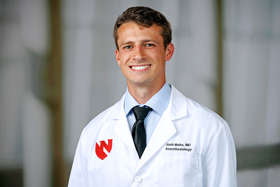 Joshua Mohs, MD, headshot in white lab coat