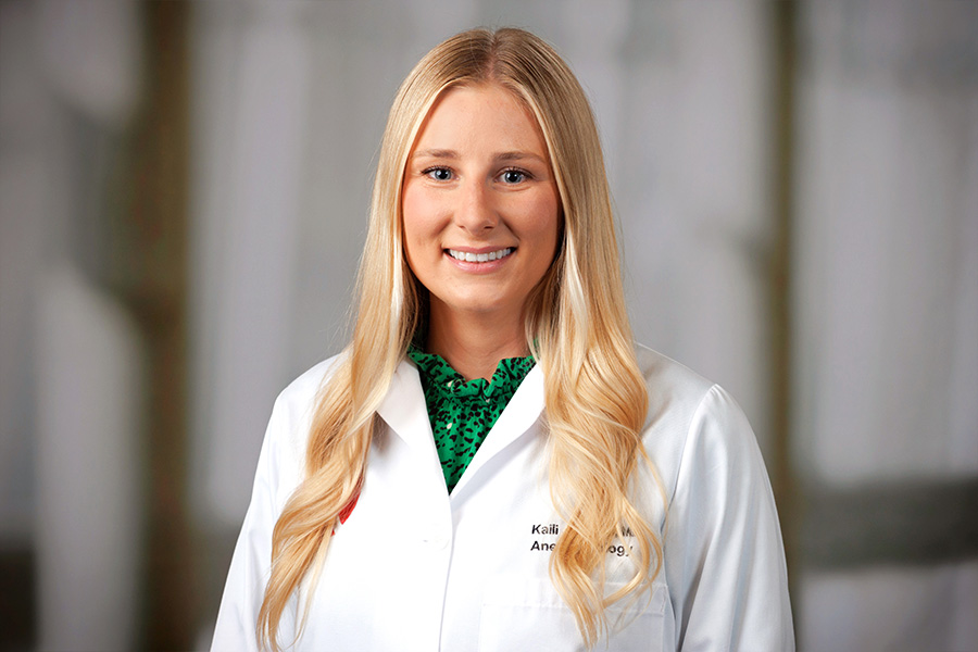 Kaili Jorgens, MD, headshot in white lab coat