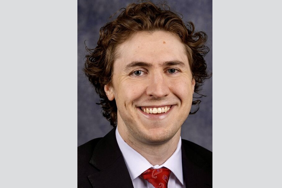 Nathaniel Evans, headshot in professional business attire.