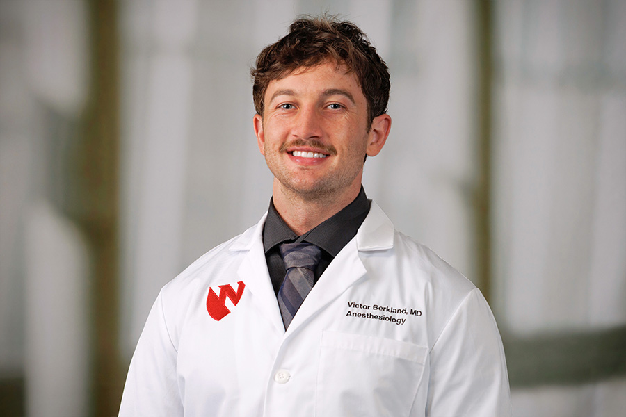 Victor Berkland, MD, headshot in white lab coat