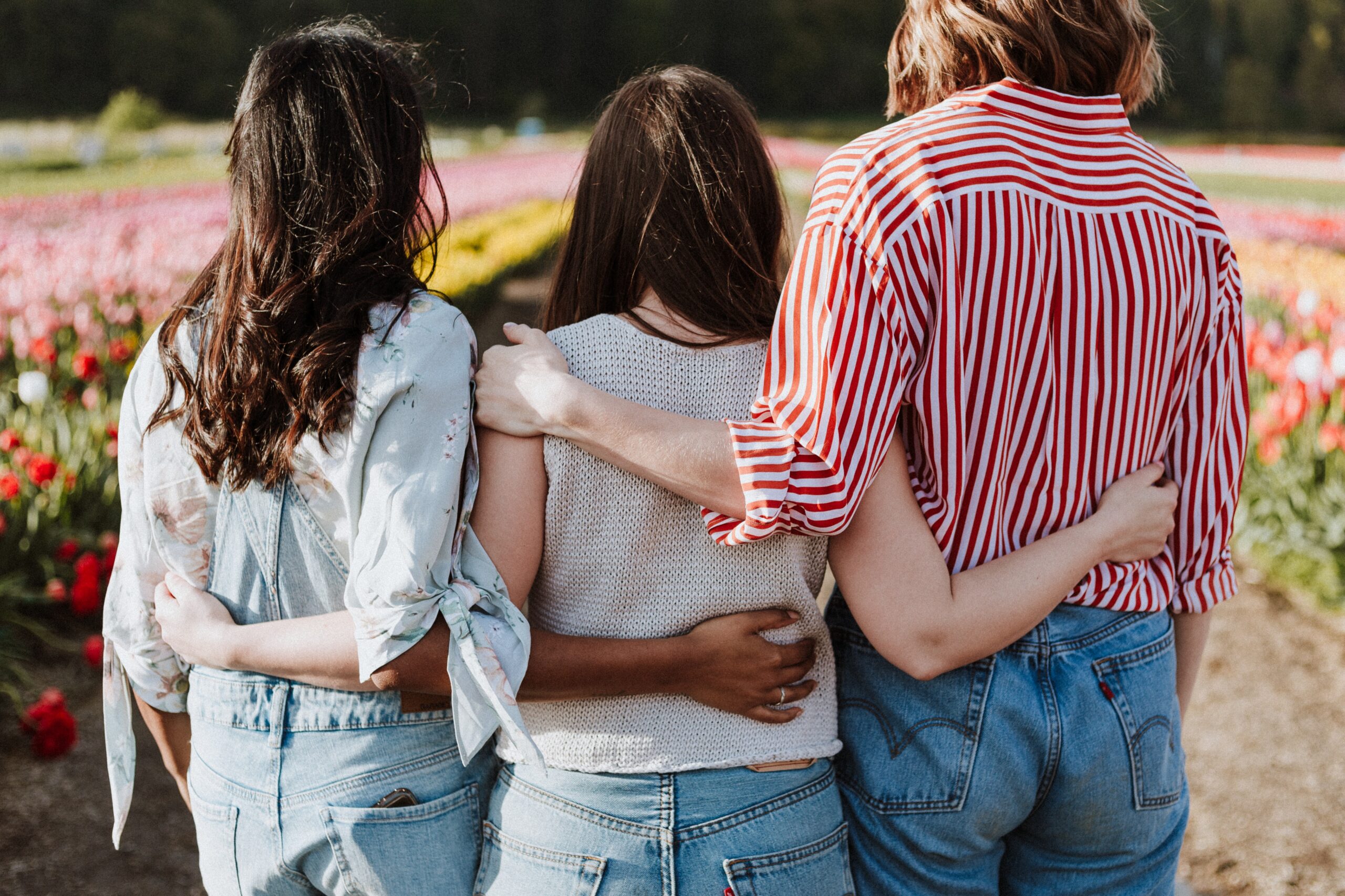 women embracing and supporting one another