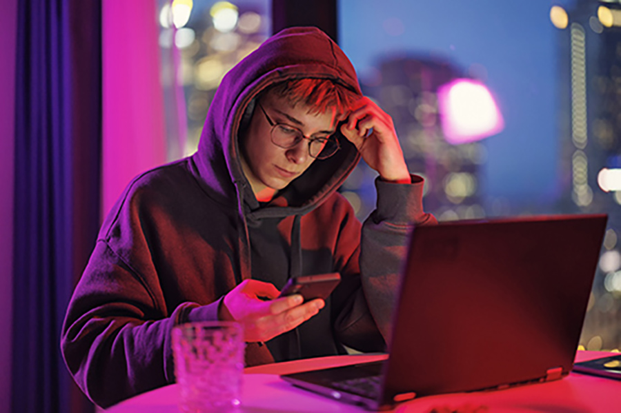 Teen on his smartphone. 