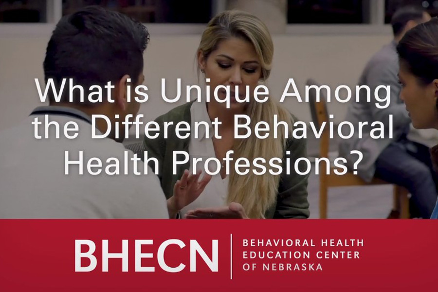 In the background, a woman speaks to a man and another woman. In the foreground, the text "What is Unique Among the Different Behavioral Health Professions?" with the BHECN logo