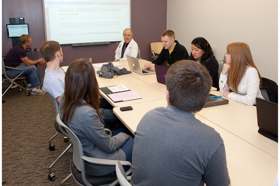 A group of students attend a presentation