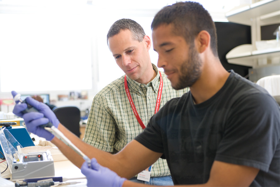 A student and faculty member observe research results