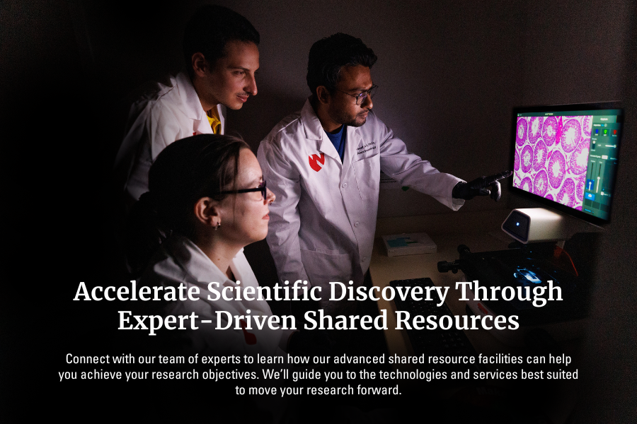 Exterior of a building with a sign reading "Suzanne and Walter Scott Cancer Research Tower"